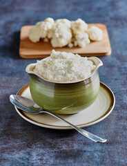 mashed cauliflower made with garlic cream, salt, and pepper