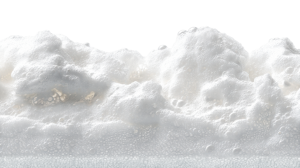 Close-up of effervescent white foam with numerous tiny bubbles and larger spheres against a bright white background, cut out transparent