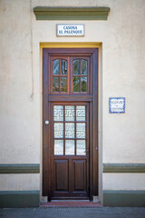 Obraz premium red door in the old building