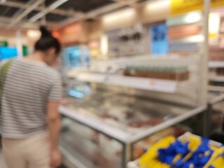 Abstract bokeh image of a retail store's frosted glass display case.
