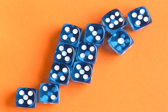 Blue game dices on orange background