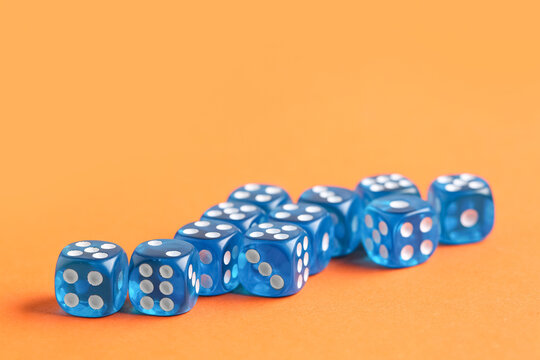 Blue game dices on orange background