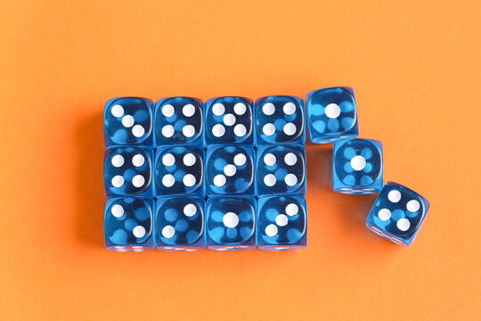 Blue game dices on orange background