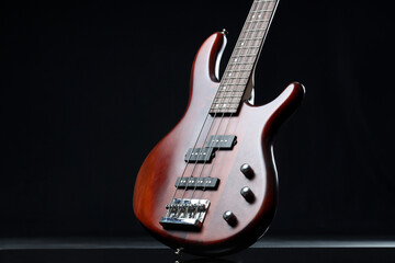 Fototapeta premium Modern electric guitar on black background