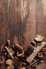 Natural Elements on Wooden Surface with Pinecones and Leaves