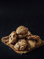 Freshly Baked Cookies on a Rustic Plate with Dark Background