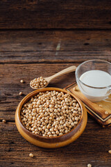 Fresh Soybeans and Glass of Soy Milk on Rustic Wooden Table