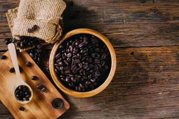 Natural Coffee Beans in Wooden Bowl on Rustic Wooden Table