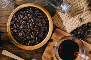 Freshly Roasted Coffee Beans in Rustic Setting with Glass Cup