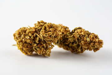 Close-up of Natural Dried Cannabis Buds on White Background