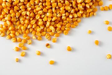 Yellow Corn Kernels Piled on White Surface for Food Background