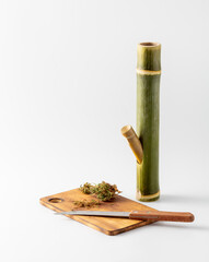 Bamboo Kitchen Tool with Herbs on Wooden Cutting Board