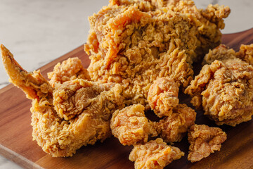 Crispy Fried Chicken Pieces on Wooden Platter Ready to Serve