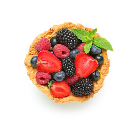 Sweet tartlet with different fresh berries and mint on white background