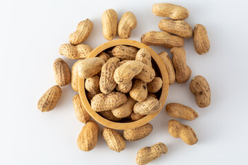 Aesthetic Bowl of Raw Peanuts Surrounded by Nuts on White Surface