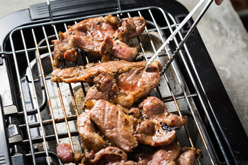 Grilled Meat Cooking on Barbecue Grill in Outdoor Setting