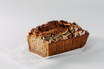 Freshly Baked Nut Loaf with Almond Topping on White Background