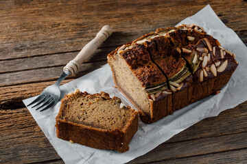 Freshly Baked Almond Banana Bread Loaf on Rustic Wooden Table