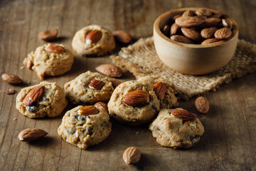 Freshly Baked Cookies with Almonds on Rustic Wooden Table