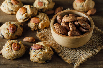 Delicious Cookies with Almonds on Rustic Wooden Background