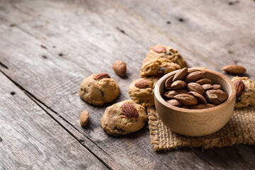 Freshly Baked Cookies and Almonds on Rustic Wooden Table Surface