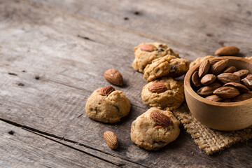 Freshly Baked Cookies with Almonds on Rustic Wooden Table