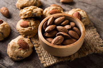 Freshly Baked Cookies with Almonds on Rustic Wooden Table