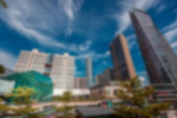 Obraz premium An abstract view of a modern cityscape with tall buildings and a blue sky.