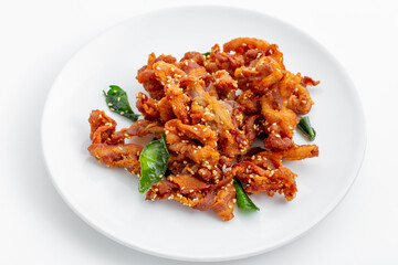 Crispy Fried Snack Garnished with Green Leaves on White Plate