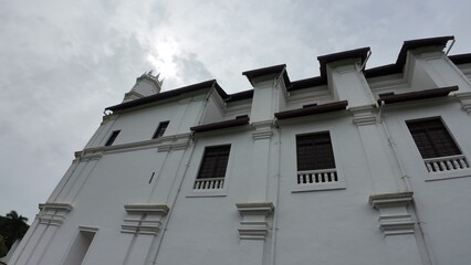 Church and Convent of St. Francis of Assisi in Old Goa, showcasing colonial Portuguese architecture under cloudy skies