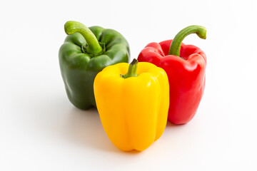 Fresh Colorful Bell Peppers on a White Background for Healthy Cooking