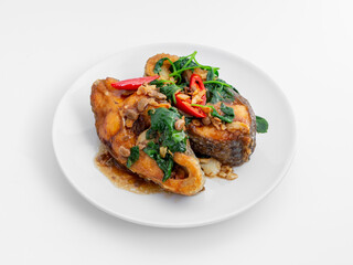 Fried Fish with Vegetables and Spicy Sauce Garnish on Plate