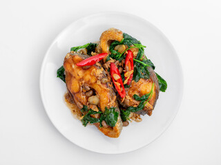 Delicious Cooked Chicken Dish with Spinach and Red Chili Peppers