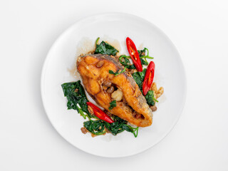 Delicious Pan-Seared Fish Fillet with Spinach and Chili Garnish