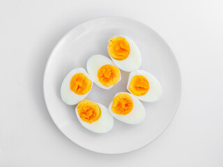 Sliced Boiled Eggs on White Plate Arranged in Circular Pattern