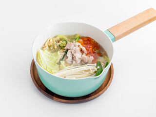 Fresh and Colorful Asian Noodle Soup in a Modern Cooking Pot