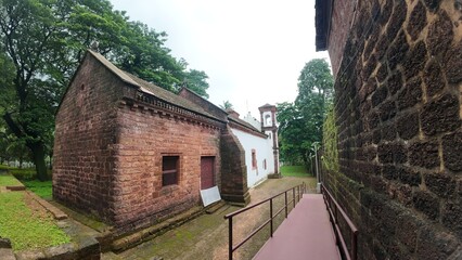  Exterior view of the historic Chapel of St. Catherine, showcasing medieval architecture on a cloudy, rainy day