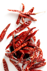 Dried Red Chili Peppers in a Metal Bowl on White Background