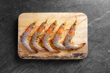 Fresh Raw Shrimp on Wooden Cutting Board Ready for Cooking