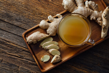 Fresh Ginger Root and Herbal Tea on Wooden Surface Display