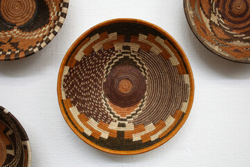 setswana weaved baskets, african art hanging on the wall, botswana small local business in the village