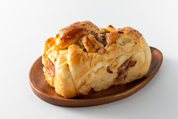 Freshly Baked Savory Bread Loaf on Wooden Plate for Culinary Use