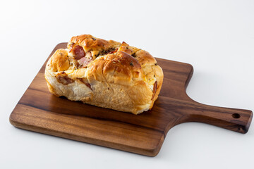 Freshly Baked Bread Loaf on Wooden Cutting Board Display