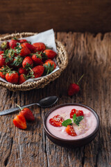 Creamy Strawberry Yogurt with Fresh Berries on Rustic Wooden Table