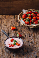 Fresh Strawberry Yogurt with Mint on Rustic Wooden Table