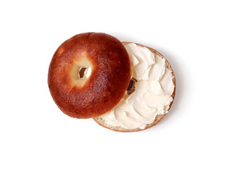 A delicious plain bagel topped with cream cheese. 