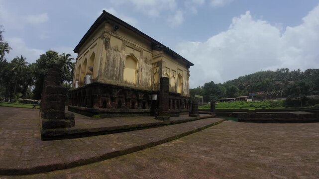 Safa Masjid in Ponda, Goa, showcasing its holy architecture and a serene sacred pond in the foreground