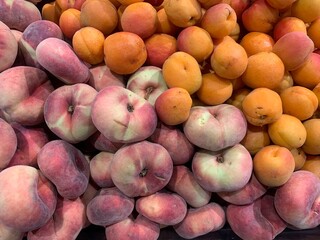 Fresh Flat Peaches and Apricots at Market