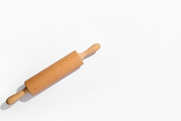 Wooden rolling pin on grey background