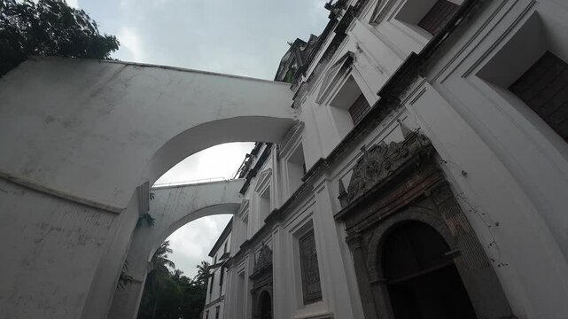 Architectural detail of flying buttresses at St. Monica Convent, Old Goa, highlighting the historic structure's elegance